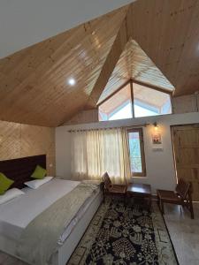 Un pat sau paturi într-o cameră la Apple Inn Wandervale Cottage