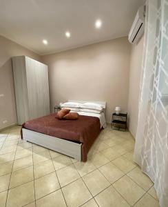 Postel nebo postele na pokoji v ubytování Donna Teresa Casa Vacanze