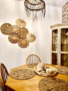 a dining room with a wooden table with some food on it at Terra Massa in Sinemorets