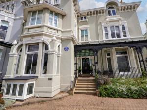 a large white house with the front door open at Ismay Lounge Apartment- Titanic Interest in Liverpool