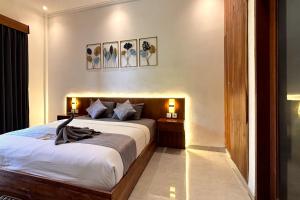 Postel nebo postele na pokoji v ubytování Bali Bata Canggu Guesthouse + 21 fotografií