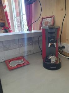 a coffee maker sitting on top of a counter at Résidence La Rose in La Bourboule