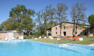 a swimming pool in front of a house at Can Dansa in Sant Andreu Salou