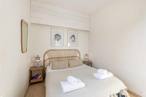 Postel nebo postele na pokoji v ubytování Maison des Embruns - 2 chambres et Jardin clos