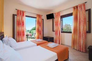 A bed or beds in a room at Angelique Apartments