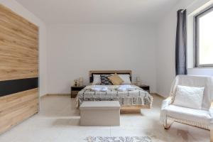 Postel nebo postele na pokoji v ubytování balluta mansions
