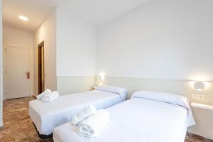 Postel nebo postele na pokoji v ubytování Hostal La Vía Verde