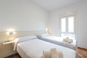 Postel nebo postele na pokoji v ubytování Hostal La Vía Verde
