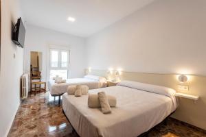 Postel nebo postele na pokoji v ubytování Hostal La Vía Verde