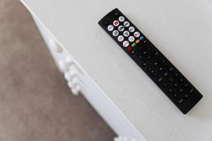 Televiisor ja/või meelelahutuskeskus majutusasutuses Cosy 3BR in Coronation Terrace