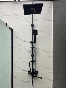 a basketball hoop on a pole next to a wall at Avant Daireleri in Baku
