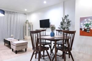 a dining room with a table and chairs at Minato House Bophut in Nathon Bay