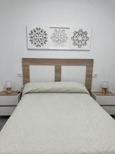 Ένα ή περισσότερα κρεβάτια σε δωμάτιο στο Apartamento Rincón del Olivar II +16 φωτογραφίες