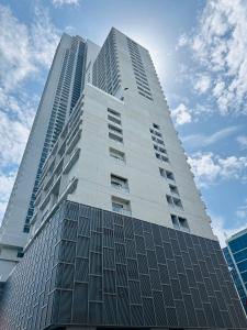 a tall white building with many windows on it at The address, Colombo in Colombo