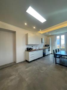 a kitchen and dining room with a table and chairs at airport apartments piano superiore in San Maurizio Canavese