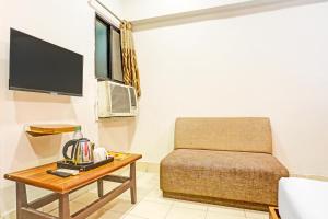 TV o dispositivi per l'intrattenimento presso Super Hotel O Jaistambh Chowk Formerly Guru Kirpa