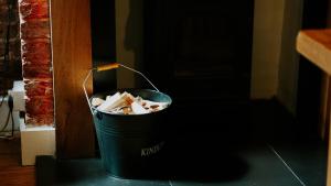 a trash can full of trash sitting on the floor at Station House in Horsham +14 photos