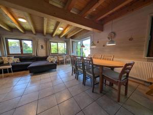 a living room with a table and chairs at Ferienhaus Dürr23 in Lauterbach