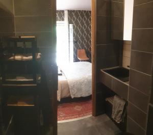 Ένα ή περισσότερα κρεβάτια σε δωμάτιο στο Chambre à la campagne