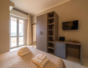 Postel nebo postele na pokoji v ubytování Hotel Continental
