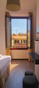 Ένα ή περισσότερα κρεβάτια σε δωμάτιο στο Leone XIV Firenze