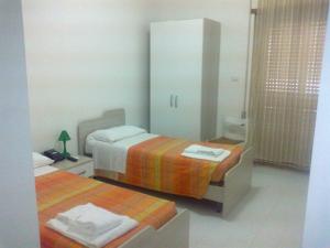 Postel nebo postele na pokoji v ubytování Hotel Aurora + 20 fotografií