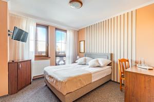 Postel nebo postele na pokoji v ubytování Zajazd Żuławy - Restauracja & Hotel