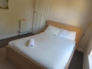 Postel nebo postele na pokoji v ubytování Seamless Stays