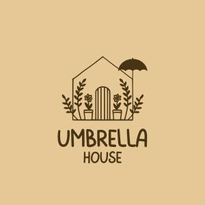 ティラナにあるUmbrella Houseの傘と家のイラスト