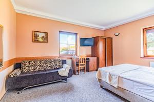 Postel nebo postele na pokoji v ubytování Zajazd Żuławy - Restauracja & Hotel
