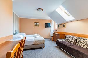 Postel nebo postele na pokoji v ubytování Zajazd Żuławy - Restauracja & Hotel