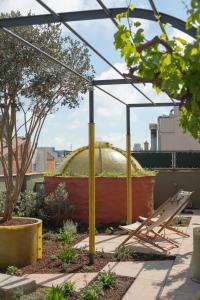 a building with a dome on top of a roof at Hotel Casa Bonay & Spa in Barcelona