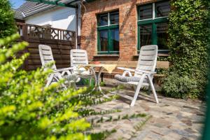 a group of chairs and a table on a patio at pinocchio pirow in Pirow