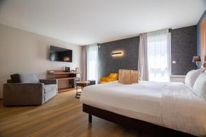 Postel nebo postele na pokoji v ubytování Best Western Côte des Sables Plouescat