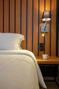 Postel nebo postele na pokoji v ubytování Best Western Côte des Sables Plouescat