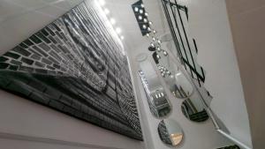 a room with a picture of a building on the wall at Brown condo in Lekki +24 photos