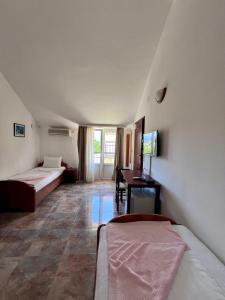 Postel nebo postele na pokoji v ubytování Hotel Max