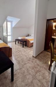 Postel nebo postele na pokoji v ubytování Hotel Max