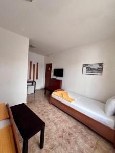 Postel nebo postele na pokoji v ubytování Hotel Max