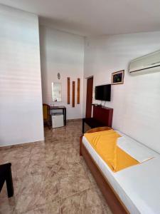 Postel nebo postele na pokoji v ubytování Hotel Max