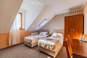 Postel nebo postele na pokoji v ubytování Zajazd Żuławy - Restauracja & Hotel