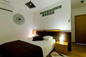 Uma cama ou camas num quarto em Casa da Ladeira, Turismo Rural