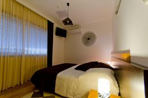 Uma cama ou camas num quarto em Casa da Ladeira, Turismo Rural