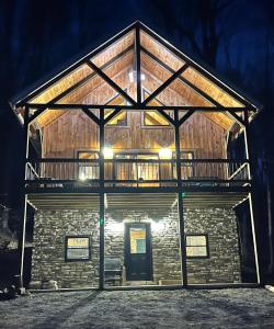 a large building with a deck on top of it at Sage Hill Escape in Londonderry