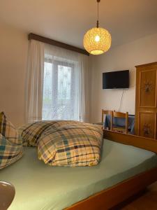 Postel nebo postele na pokoji v ubytování Haus Käfersberg