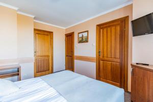 Postel nebo postele na pokoji v ubytování Zajazd Żuławy - Restauracja & Hotel