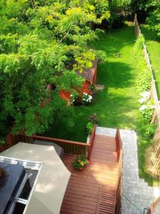 an aerial view of a backyard with a wooden deck at Luxury Home - Upper Toronto Beaches in Toronto