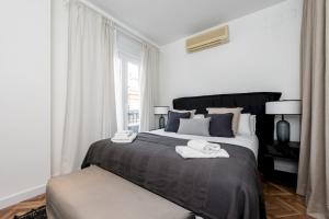 Postel nebo postele na pokoji v ubytování MintyStay - 1 BD Opera