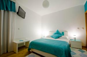 Uma cama ou camas num quarto em Casa da Ladeira, Turismo Rural