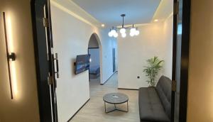 a living room with a couch and a table at Cleya House Banyuwangi in Giri